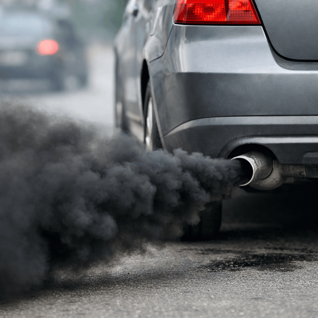 black smoke from exhaust coming from car tailpipe