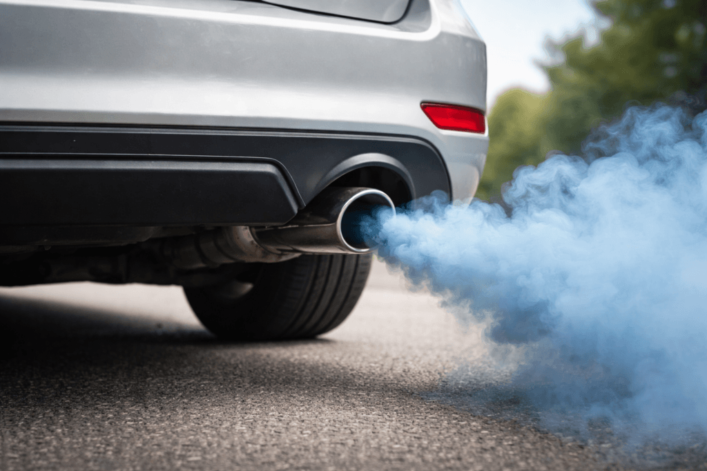 Blue smoke from exhaust coming from a car tailpipe due to engine oil burning